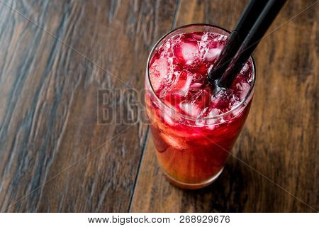 Alabama Slammer Cocktail With Black Straw.