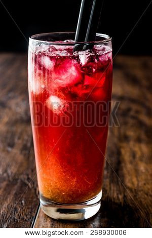 Alabama Slammer Cocktail With Black Straw.