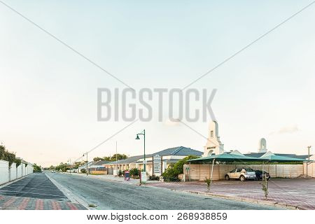 Langebaan, South Africa, August 20, 2018: A Sunset Street Scene, With The Queens-cottage Centre, Hou