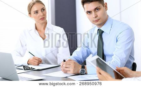 Group Of Business People Or Lawyers Discussing  Terms Of Transaction In Office. Colleagues Working A