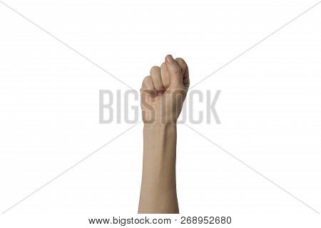 Female Hand Clenched Into A Fist And Raised Up On A White Background. Concept Of Power, Rebellion, U