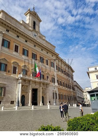 Rome, Italy - May 2018: Female Reporter, Male Operator And Young Assistant Shoot Near Chamber Of Dep