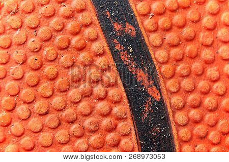 The Structure Of A Used Orange Basketball Shows The Small Nubs And Small Grains Of Sand From The Cou