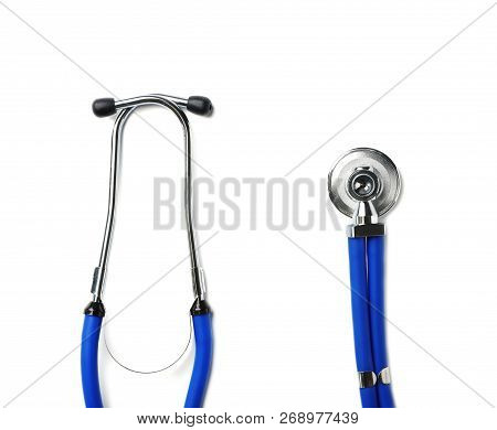 Stethoscope For Checking Pulse On White Background, Top View. Space For Text