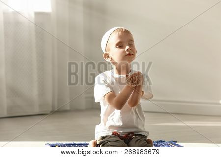 Little Muslim Boy With Misbaha Praying Indoors