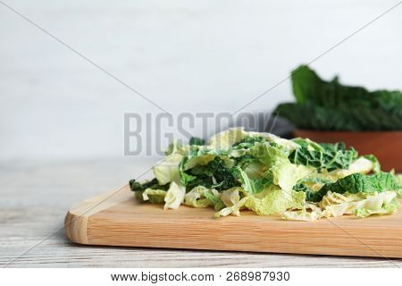 Cutting Board With Chopped Savoy Cabbage On Table. Space For Text