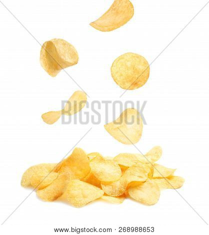 Tasty Potato Chips Falling On White Background