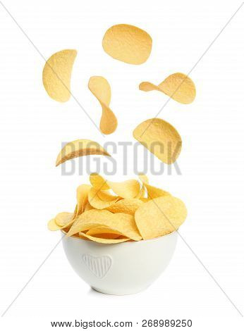 Tasty Potato Chips Falling Into Blow On White Background