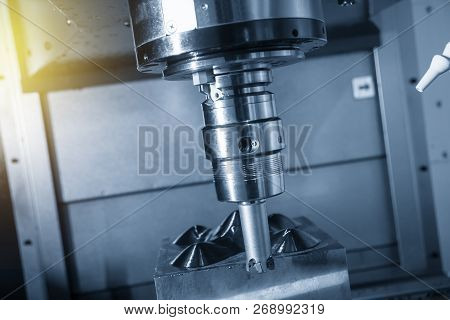 The  Cnc Milling Machine Cutting The Mold Part With The Index-able Radius End Mill Tool In Roughing 
