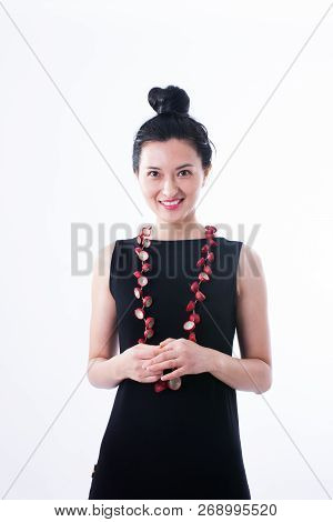Chinese Model Wearing A Black Dress And A Red Recycled Paper Necklace