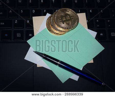 Bitcoin And Business Class Laptop, Notepad For Entries, Work And Bring Transactions. The Concept Of 