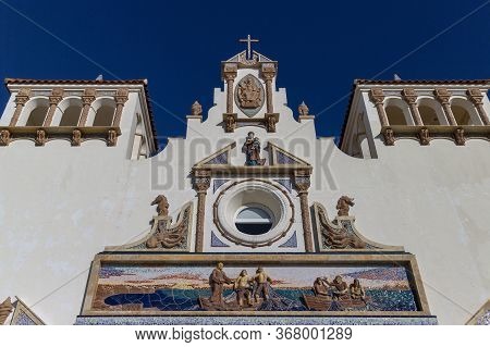 The Front White Facade Of A Church In Ayamonte, Spain.