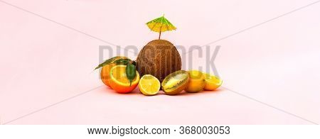 Quarantini Or Homemade Alcohol Drink With Coconut Milk And Tropical Fruits On Pink Background. The C