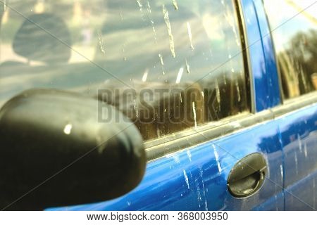 Car In Bird Droppings. Birds Polluted The Car. Blue Car In Bird Droppings. The Bird Shit On The Car