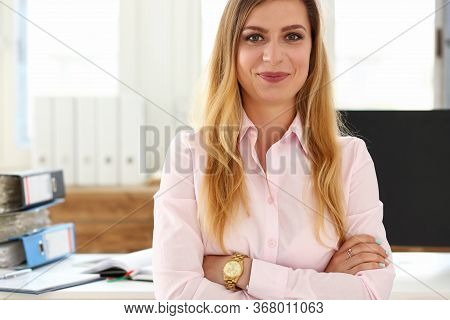 Portrait Of Smiling Businesswoman Posing With Crossed Arms In Company Office. Good-looking Employee 