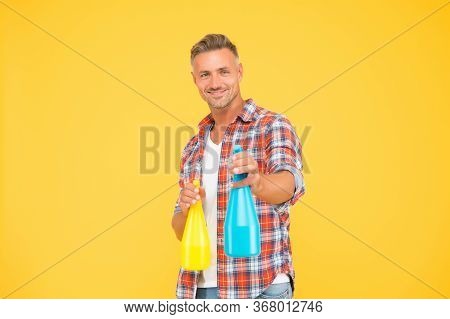 Ready To Spray. Happy Man Hold Spray Bottles Yellow Background. Spray Cleaning. Trigger Sprayer Disp