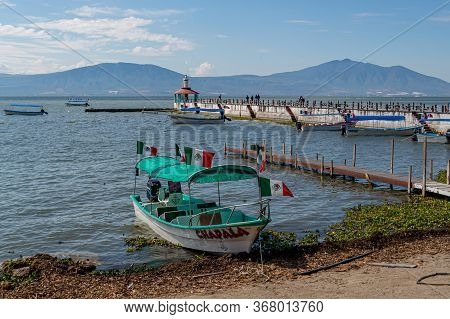 Chapala, Jalisco / Mexico, January 20th, 2020. Boat With Mexican Flags Moored On The Shore Of The La