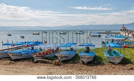 Chapala, Jalisco / Mexico, January 20. 2020. Boats With The Mexican Flags Moored On The Shore And Ot