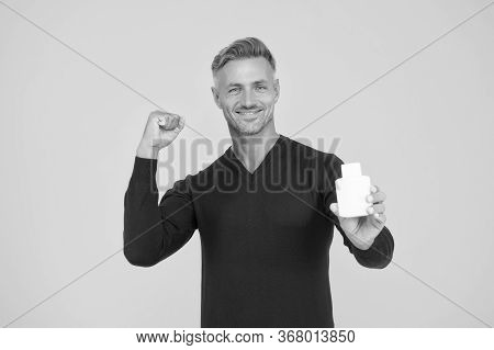 Smell Good All Day. Happy Guy Hold Cologne Bottle. Personal Hygiene. Handsome Man Presenting Hygiene