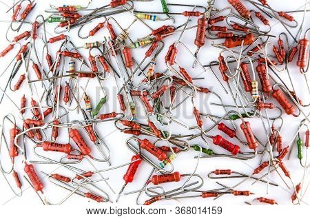 Axial Resistors In Bulk On White Background Isolated.