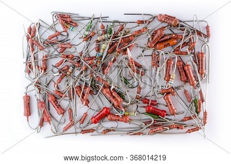 Axial Resistors In Bulk On White Background Isolated.