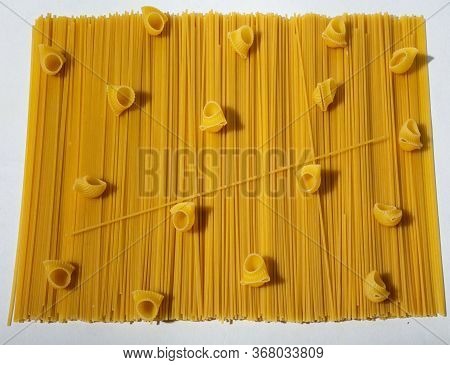 Composition Of Undigested Macaroni Pasta Made With Hard Light On A White Background.