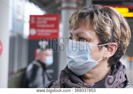 Russia Moscow Station Mcc Lokomotiv May 2020. A Woman In A Medical Mask Stands On The Peron Looks At