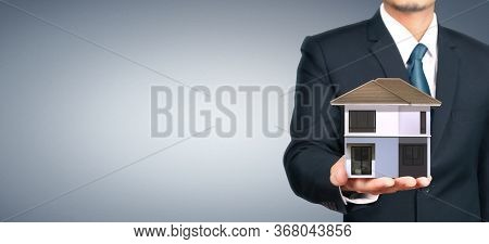 House Residential Structure In Hand.  Concept Of Investment Propert And Finance Investment Concep