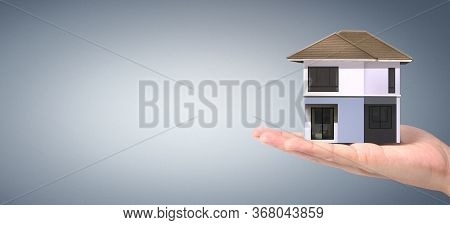 House Residential Structure In Hand.  Concept Of Investment Propert And Finance Investment Concep