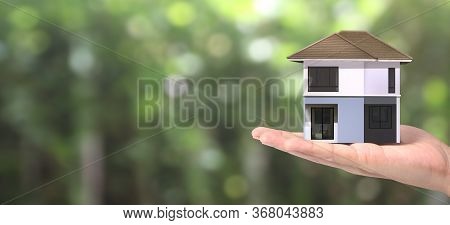 House Residential Structure In Hand.  Concept Of Investment Propert And Finance Investment Concep