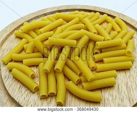 Raw Italian Sedani Rigati. Italian Maccheroni Pasta Specialty.