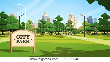 Sign Board In City Park Beautiful Summer Day Skyline Skyskraper Buildings Sunrise Cityscape Backgrou