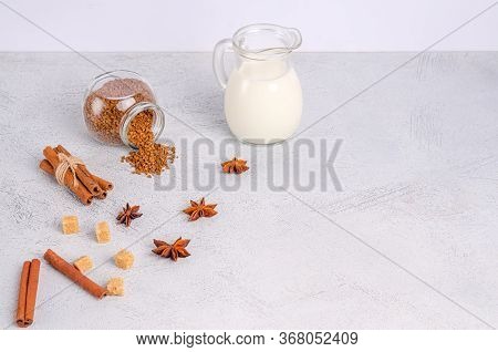 Ingredients For Dalgon Coffee Korean Drink On A Gray Background. Instant Coffee, Anise, Cinnamon, Ca