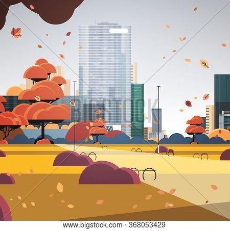 Autumn Urban Park City Skyline With Yellow Leaves Falling In Sunlight Skyskraper Buildings Cityscape
