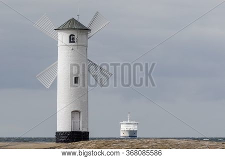 Passenger Ferry And Navigation Sign Stawa Mills - A Ship On The Horizon Sailing To The Seaport