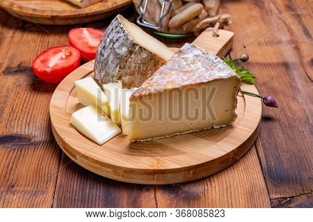 Pieces Of Cheese Tomme De Montagne Or Tomme De Savoie Made From Cow Milk In French Alps.