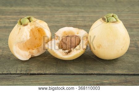 Rose Apple - Syzygium Jambos. Wood Background