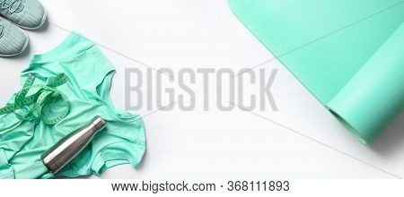 Banner Of Sport And Fitness Equipment, Female Tee-shirt,, Yoga Mat, Shoes, Water Bottle On Grey. Vie