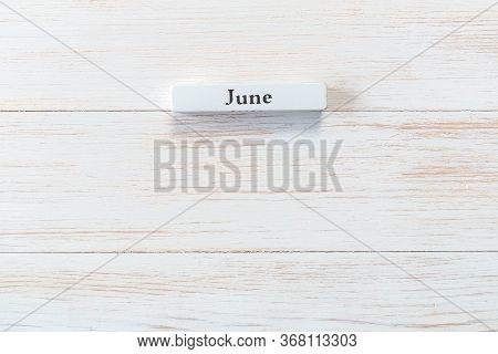 Whine Wooden Block Of Calendar With Month June On Vintage Background. Inscription June On Wood Plank