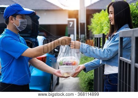 Asian Delivery Man Delivering Food, Fruit, Joice And Vegetable To Customer Home - Online Grocery Sho