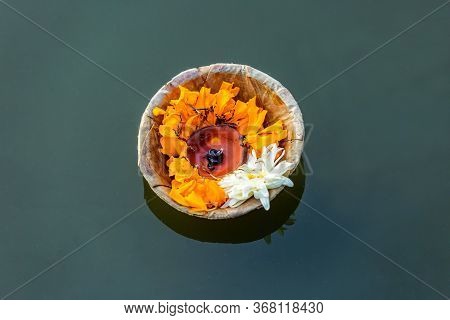 Closeup Of Butter Lamp With Flowers Offered To God At A Religious Festival Chhath Puja,offerings To 
