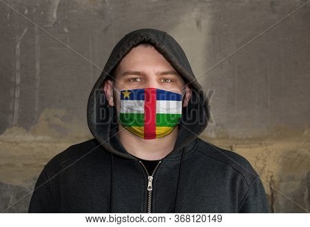 Man Wearing A Hood And A Central African Republic Flag Mask To Protect Him Coronavirus.