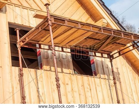 Foldable Scaffolding At New Wooden Country House Under Construction From Logs. Clip. Construction Of
