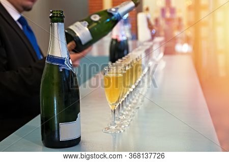 Row Of Glasses With Sparkling Wine, Champagne Or Proseco Close-up. Wine Tasting, Warm Toned Photo