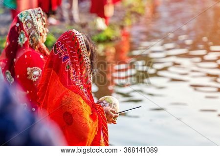 Kathmandu,nepal - November 1,2019: Hindu Devotees Offering Prayers To Sun God Standing In Water Acco