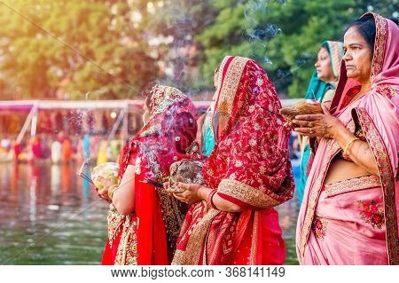 Kathmandu,nepal - November 1,2019: Hindu Devotees Offering Prayers To Sun God Standing In Water Acco