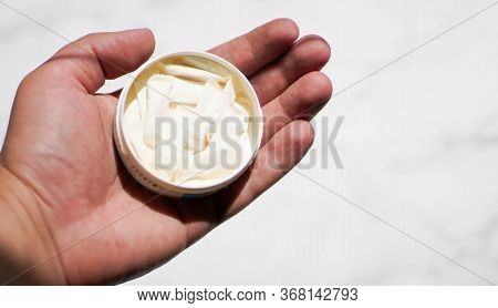 Man Holding A Box Of Swedish Nicotine , Snus