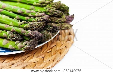 Bunch Of Fresh Raw Asparagus On White Background, Vegetarian Concept. Green Grass Sparrowgrass Stick