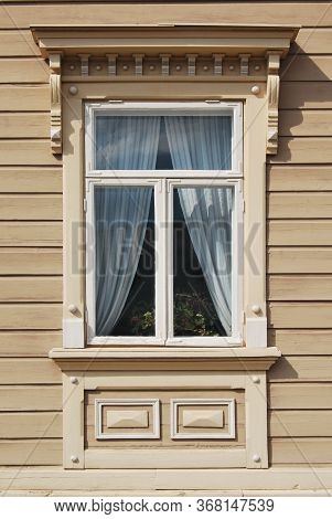 Vintage Wooden Home Vindow Decorated With Massive Portico
