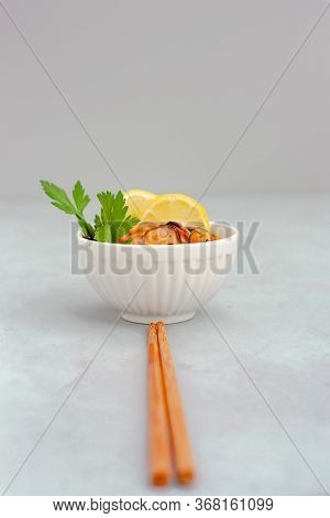 Mussels Without Shell With Lemon Slices In White Ceramic Bowl. Seafood Concept. Vertical Shot. Selec